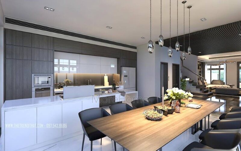Bàn ăn gỗ nguyên tấm mộc mạc kết hợp đồ nội thất hiện đại sẽ là lựa chọn ấn tượng tạo nên không gian độc đáo cho phòng ăn liền bếp.